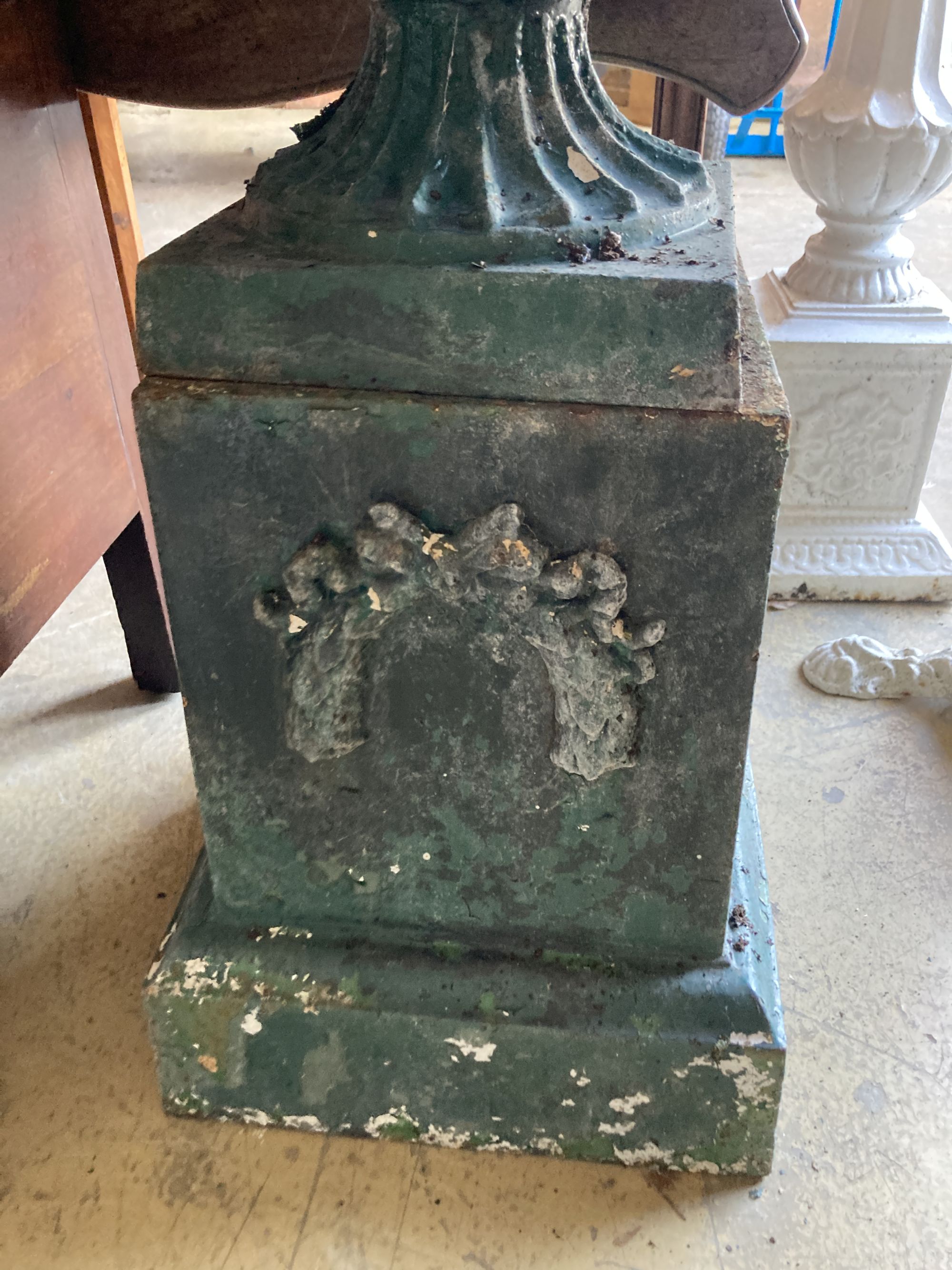 A Victorian green painted cast iron campana garden urn and pedestal, diameter 54cm, height 74cm
